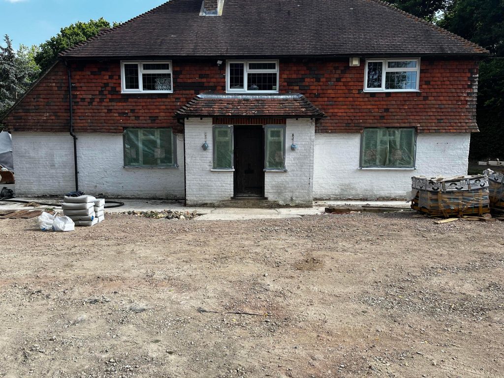House in Uckfield before sandblasting, the brick painted white