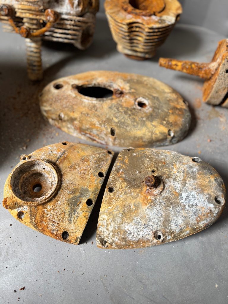 Rust-covered engine side covers restored with vapour blasting to reveal clean, textured aluminium.