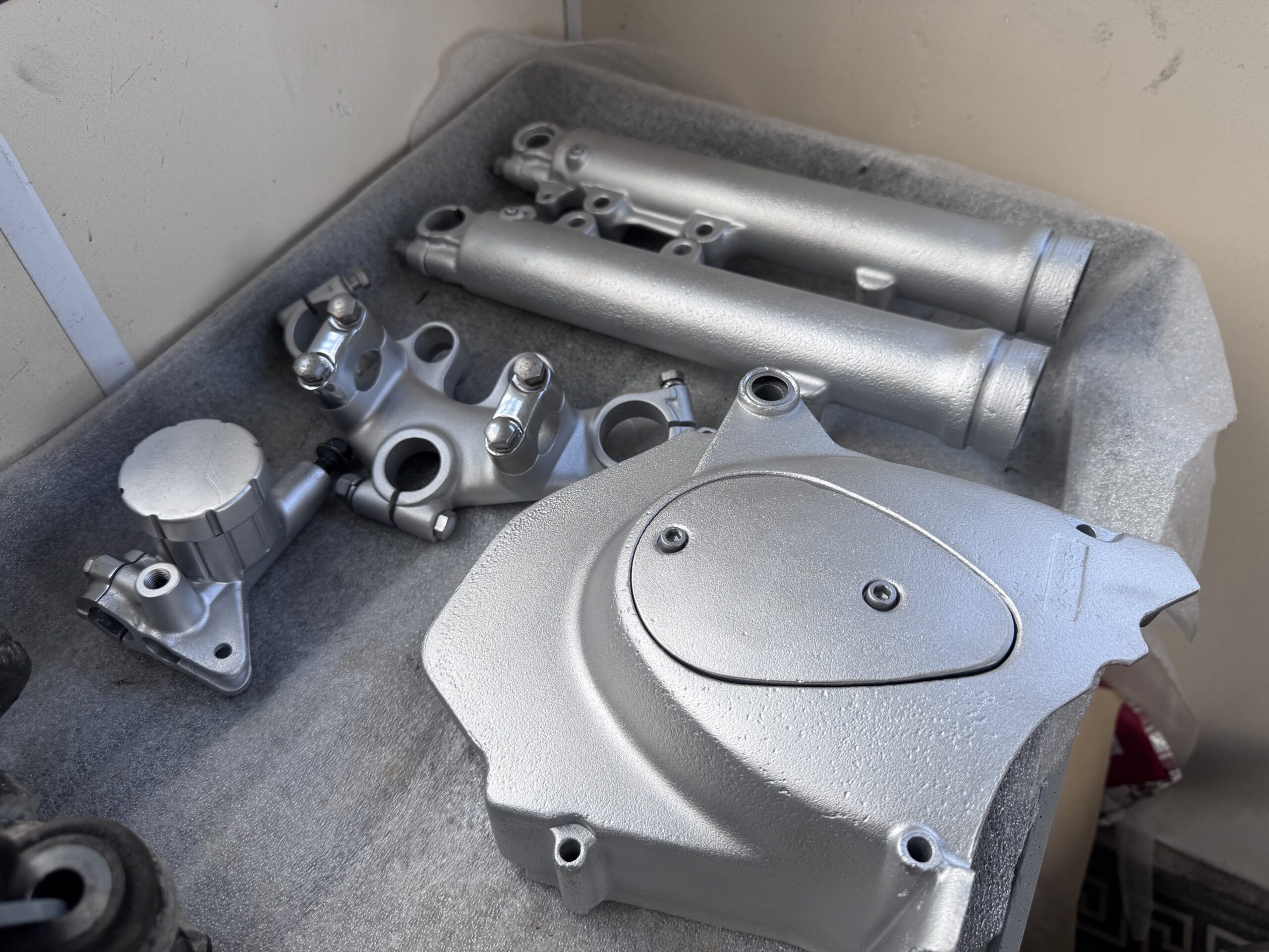 Vapour blasted motorcycle forks and engine cover