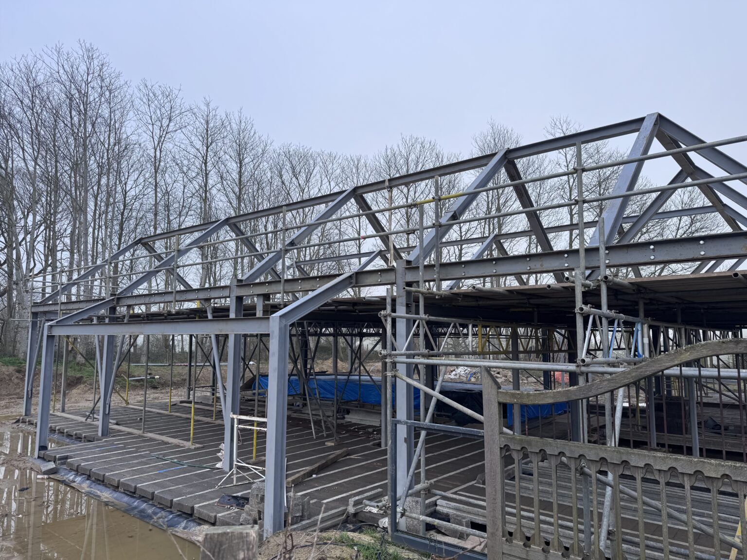 Grey steel portal frame on a building site