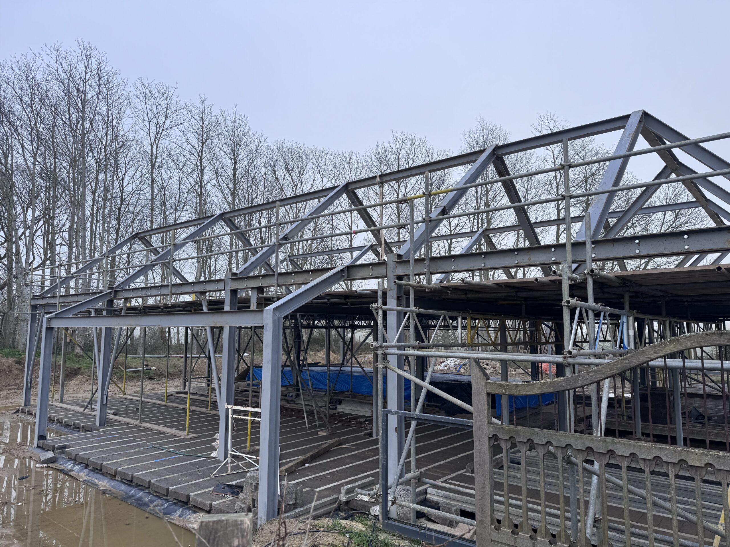 Steel portal frame blasted on site