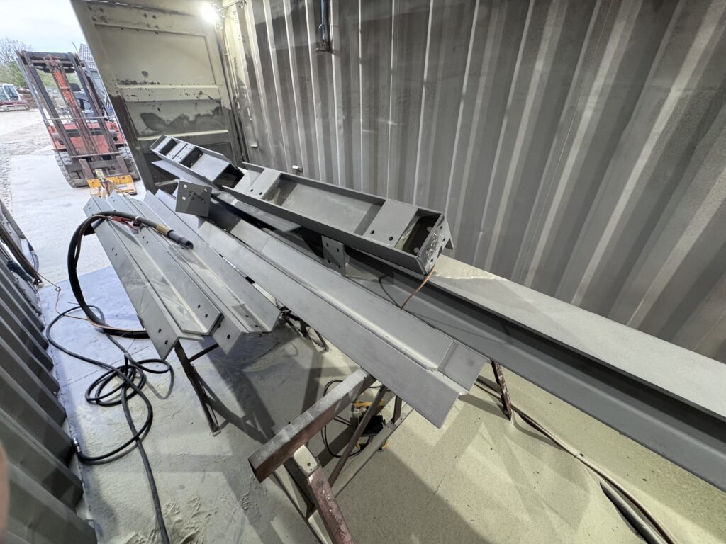 Steel beams blast cleaned to Sa 2.5