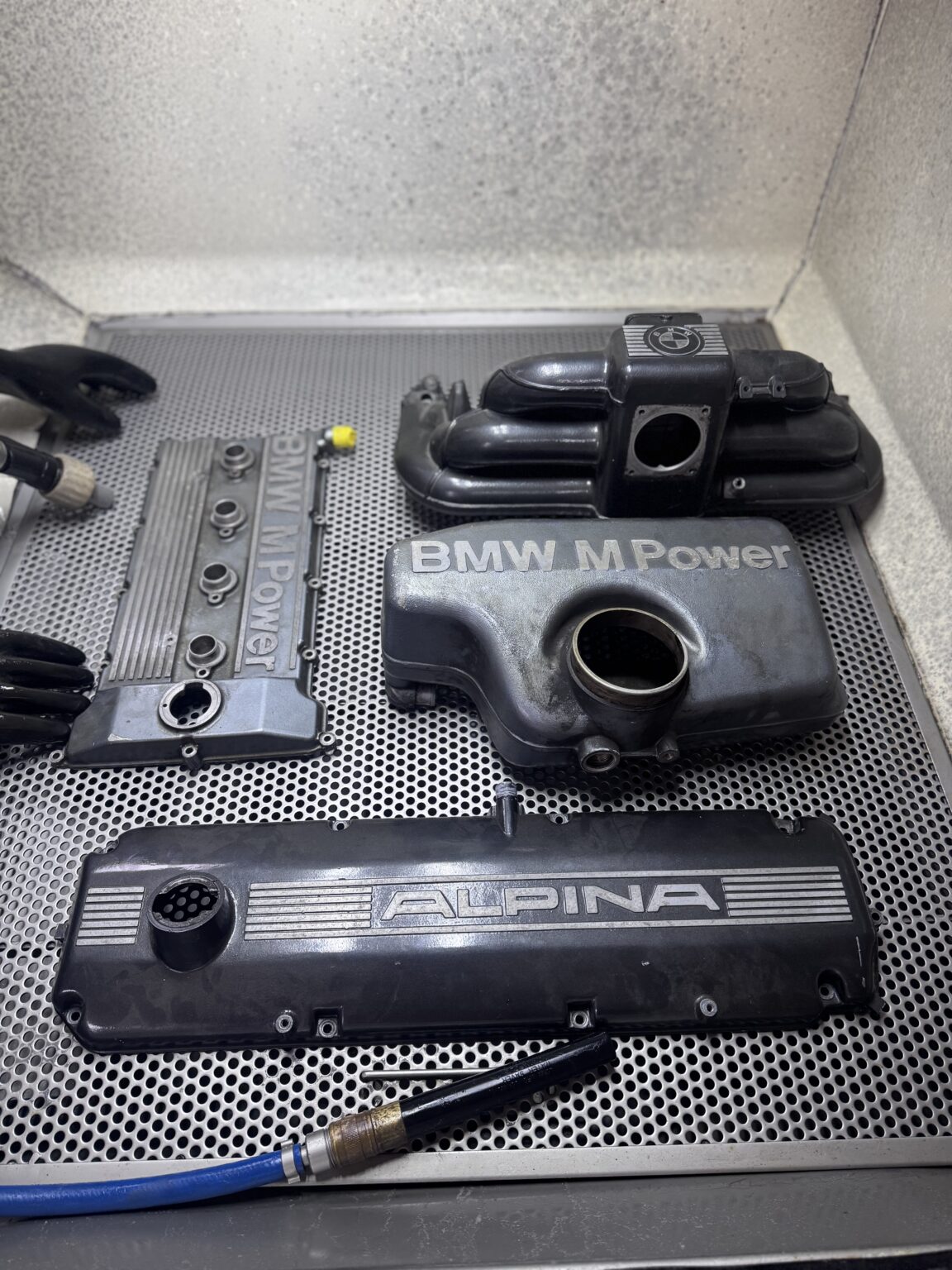 BMW and Alpina engine covers before vapour blasting