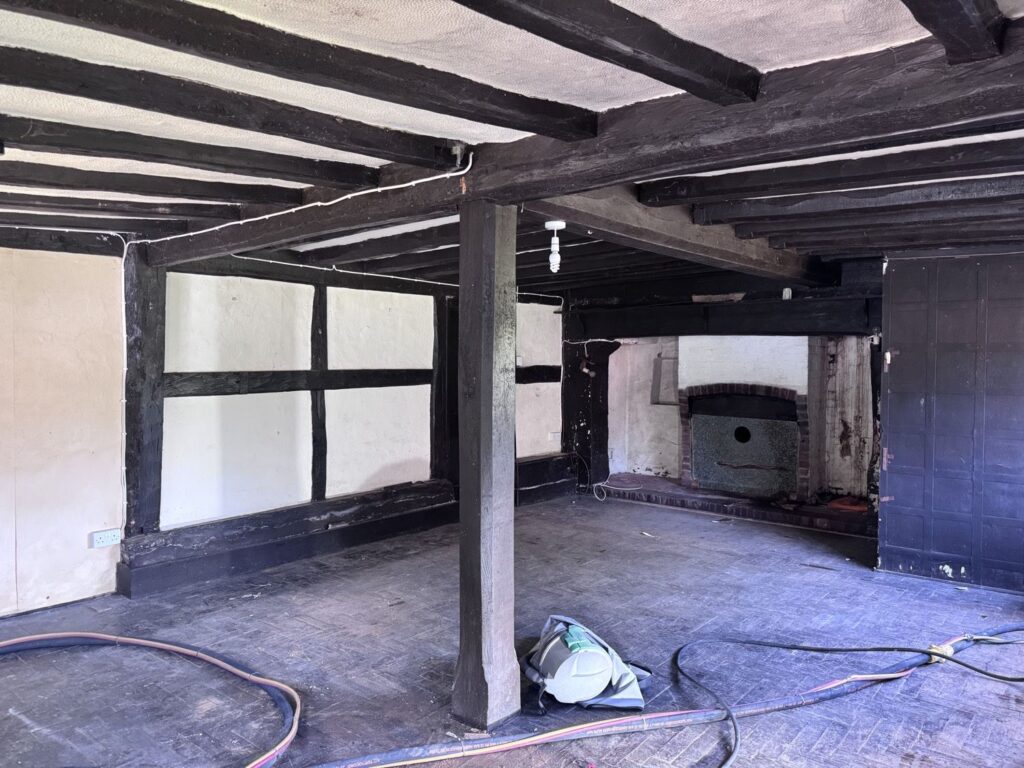 Oak beamed room before sandblasting