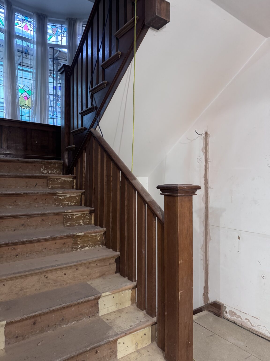 Dark oak staircase before soda blasting, Brighton