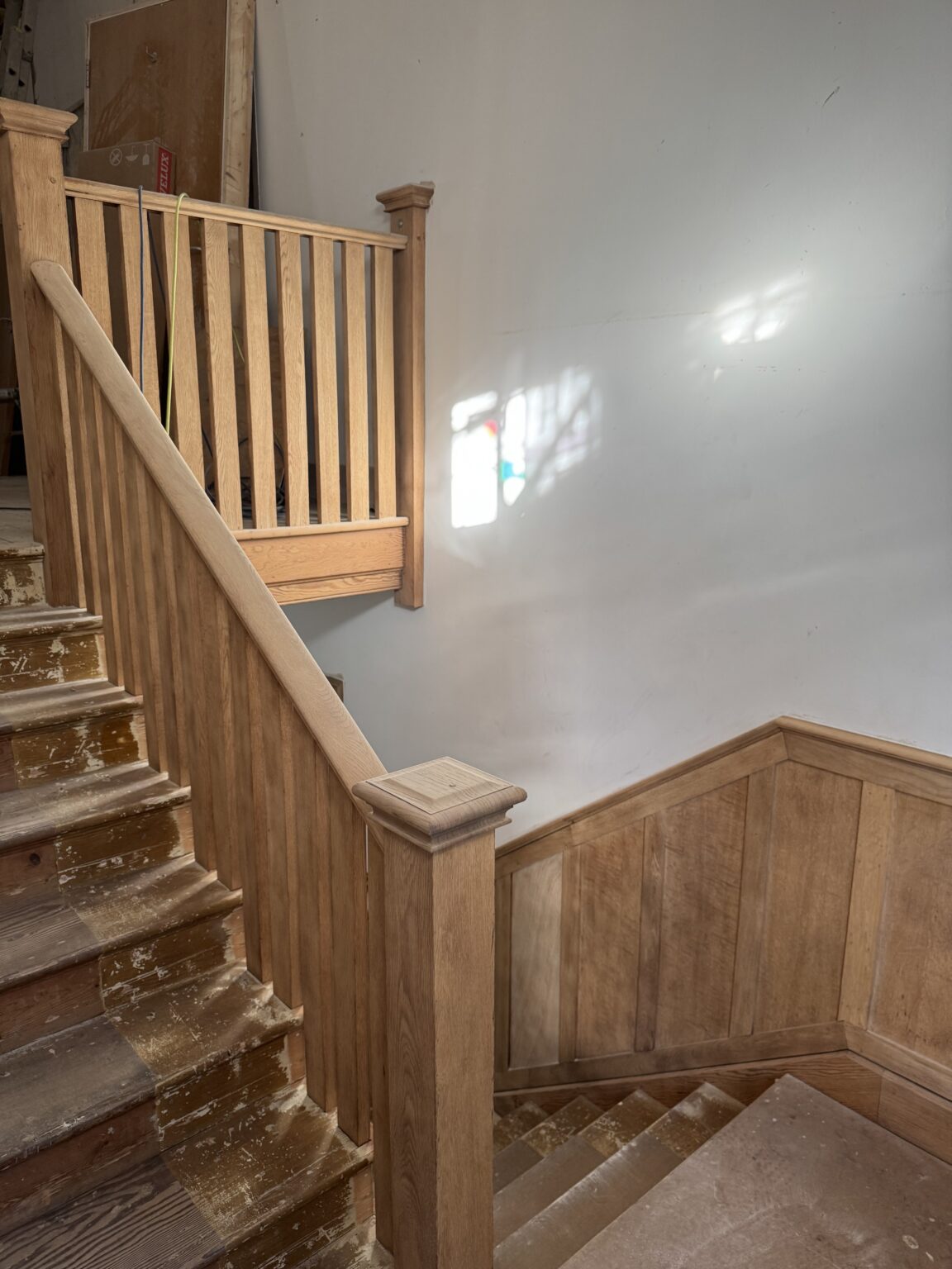 Oak landing and stair rail after soda blasting, Brighton
