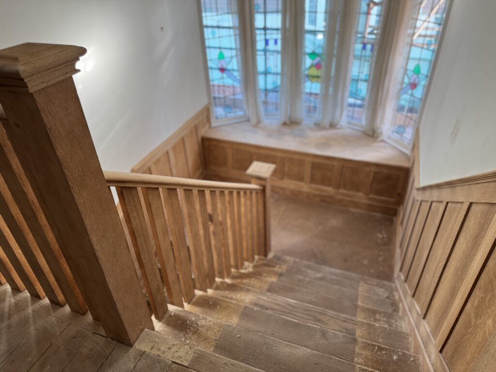 Looking down an oak staircase after soda blasting, Brighton