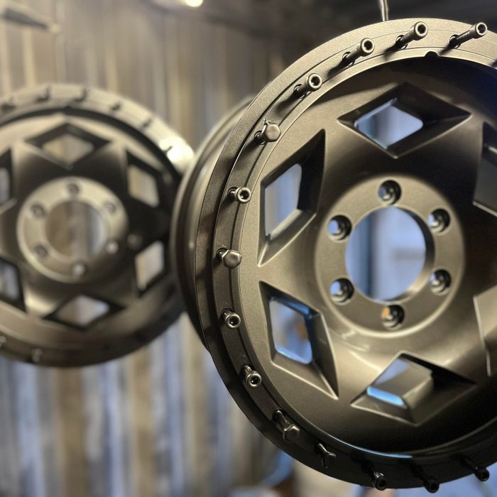 Alloy wheels powder coated in gunmetal grey by TB Blast Cleaning in Sussex.