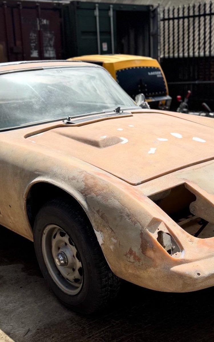Lotus Elan fibreglass body shell professionally sandblasted by TB Blast Cleaning in Hailsham, East Sussex for classic car restoration.
